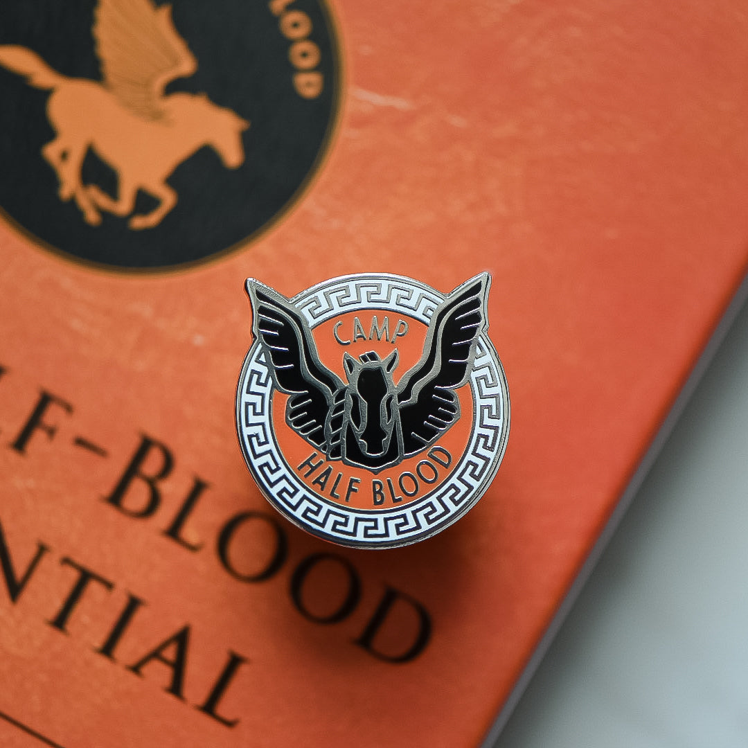 Blackjack horse inside a circle with camp half blood writing on a Percy Jackson book