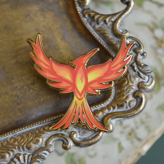 Mockingjay with red orange and yellow flame details enamel pin