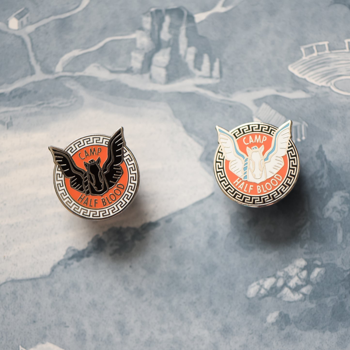 Pegasus and blackjack horse membership style pin on a Percy Jackson map