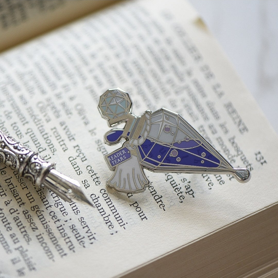 Purple and silver potion bottle enamel pin with a tag that says Reader Tears