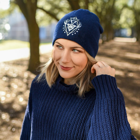Young girl wearing a magicial witch beanie in the woods
