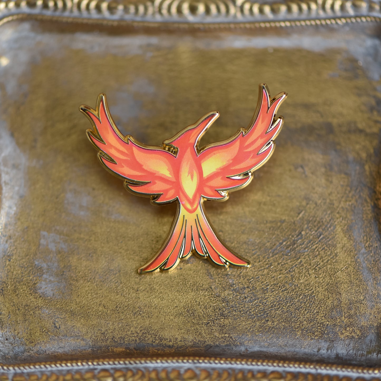 Mockingjay with red orange and yellow flame details enamel pin