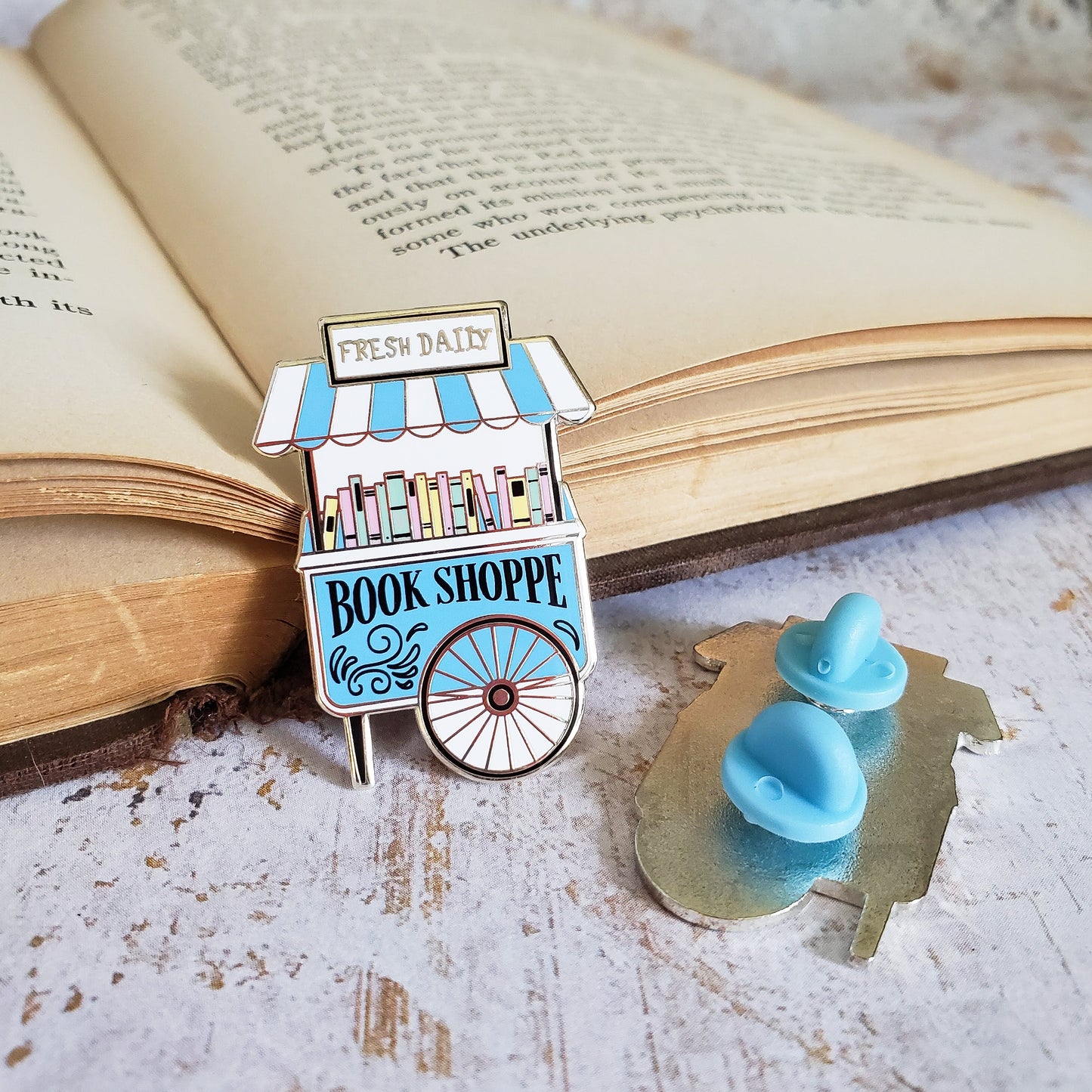 Blue and pink book cart with used books