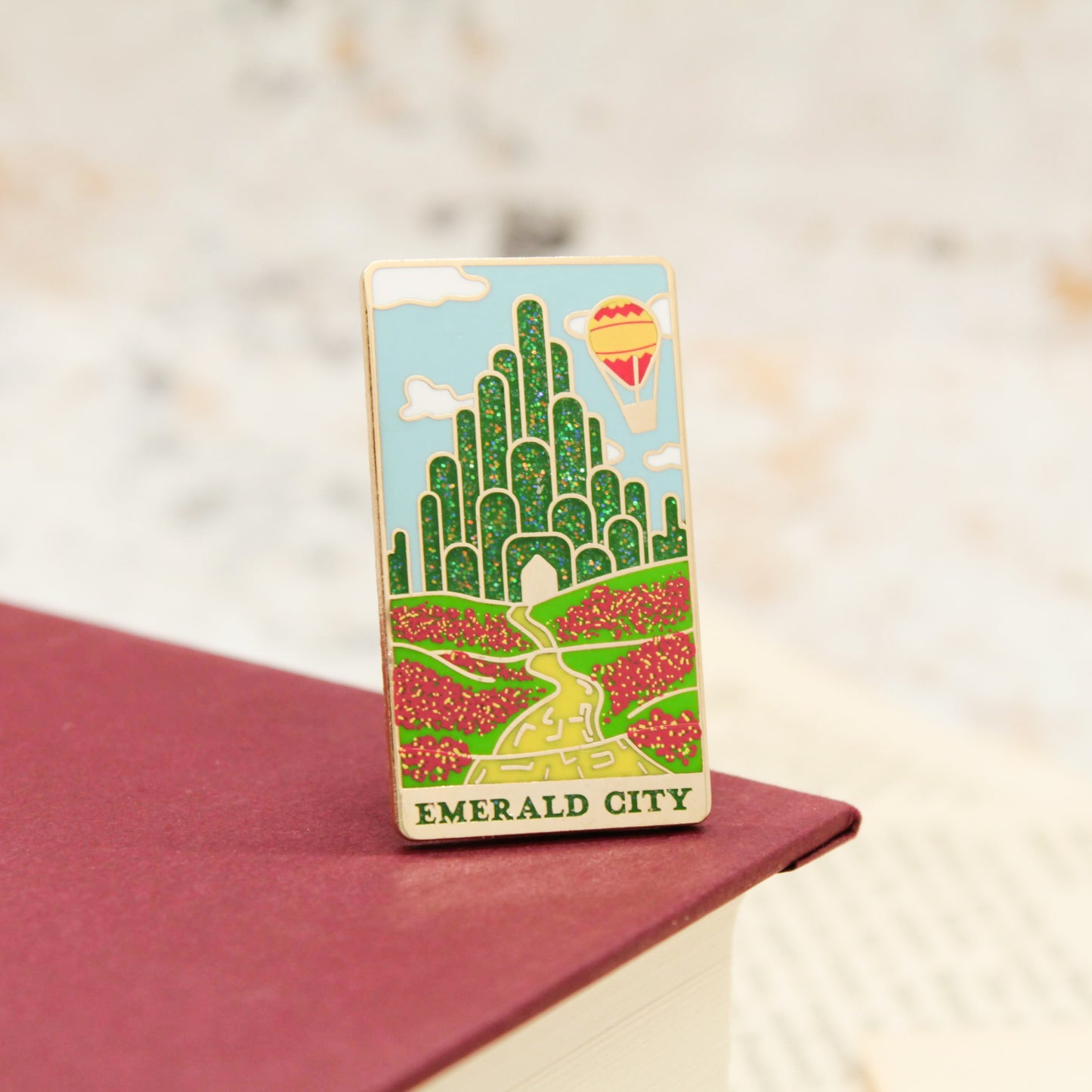 Emerald city and yellow brick road wizard of oz gold enamel pin